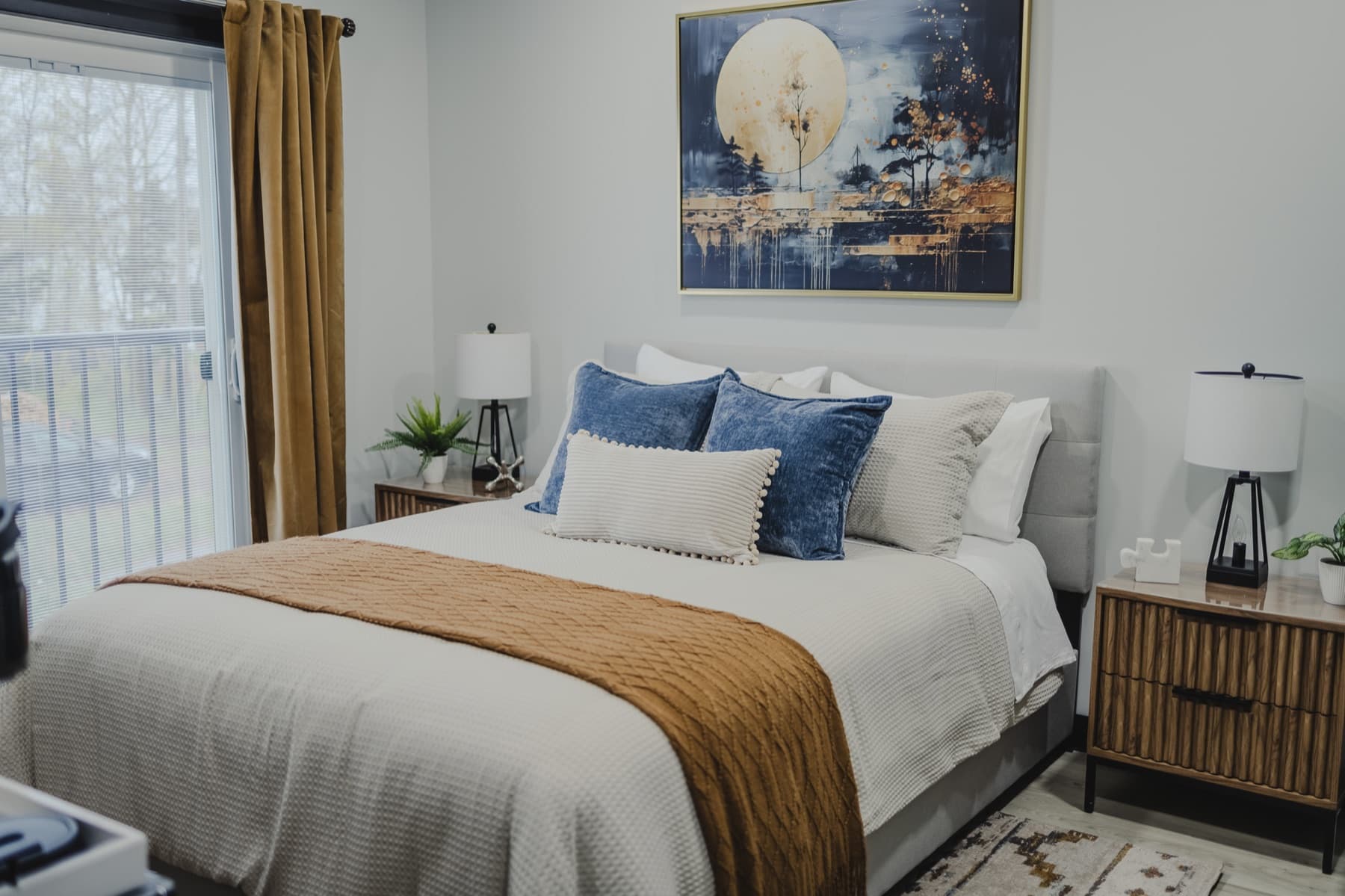 Falkenberg Suites guest suite with styled bedding and art